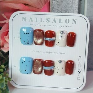 Stylish Nail Art Set with Blue, Red, and Gold Designs